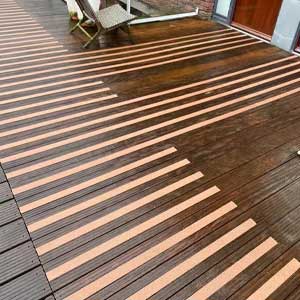 GRP anti-slip decking strips fitted to timber decking steps in wet weather