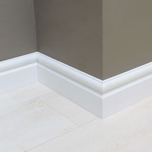 Skirting board fitted along the base of a painted interior wall
