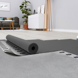 Cork underlay roll unrolled across a subfloor ready for flooring
